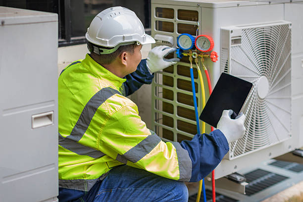 Professional Air Duct Cleaning technician working in Lenox, GA